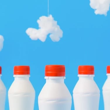 Three milkBottles stands on the image